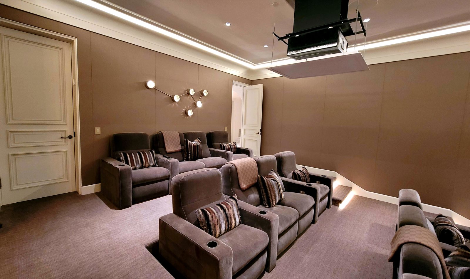 Ceiling drop projector in a Houston home theater installation by Obsidian AV