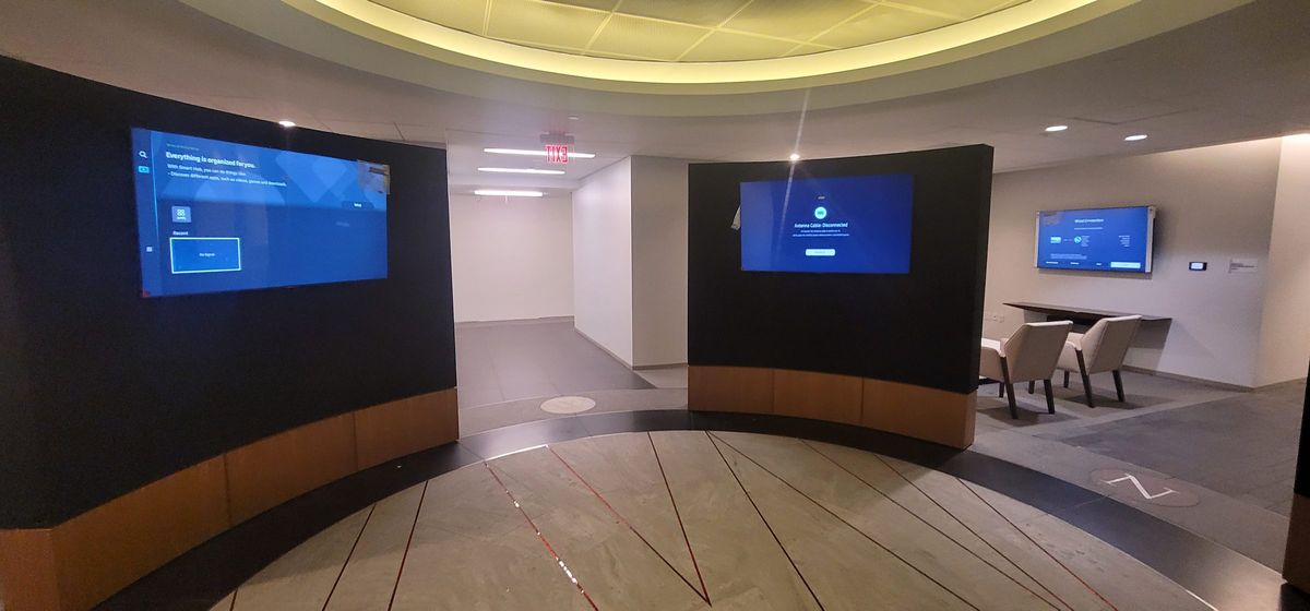 Curved lobby wall with integrated displays