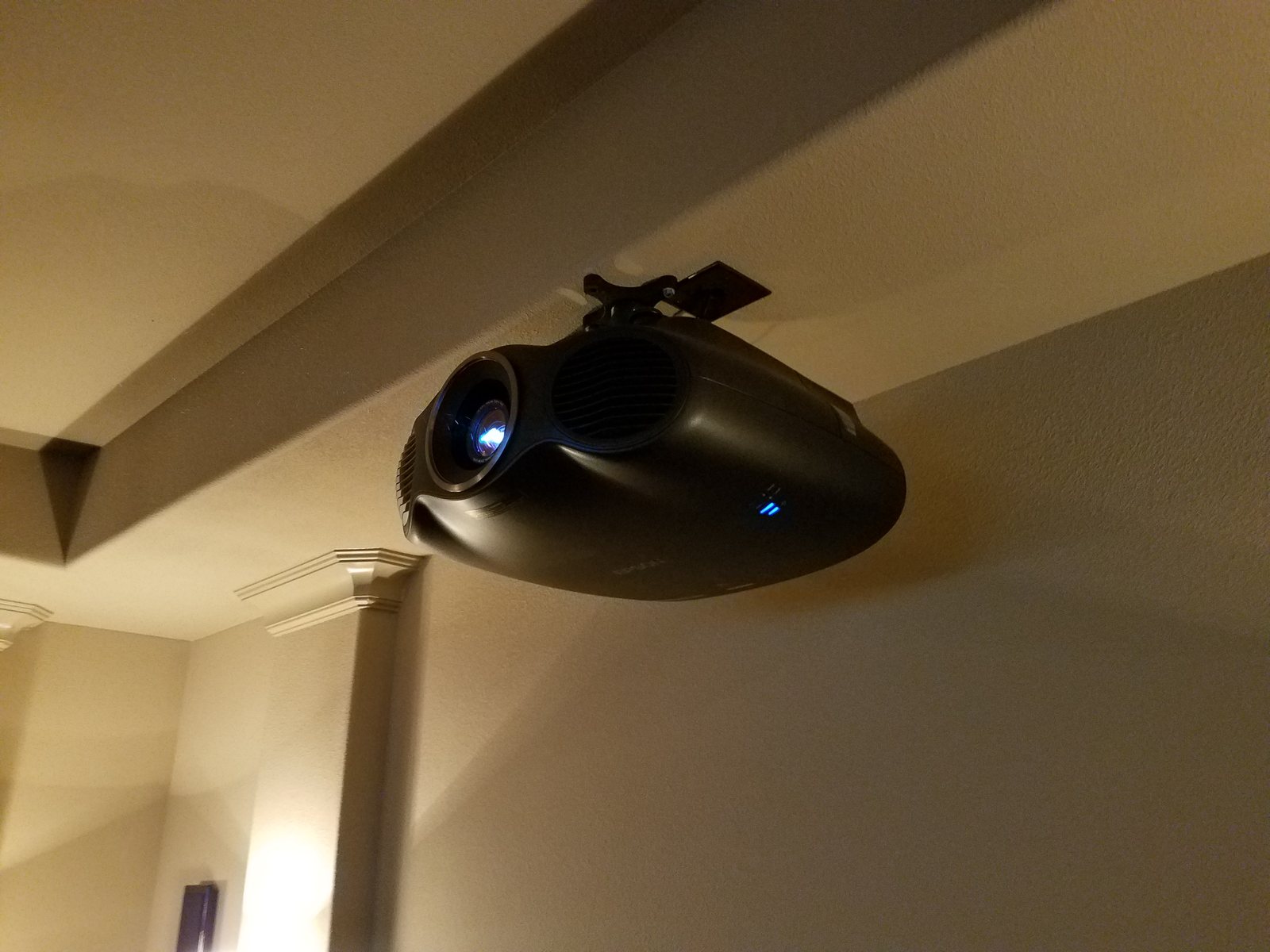 Projector on a ceiling mount in a home theater