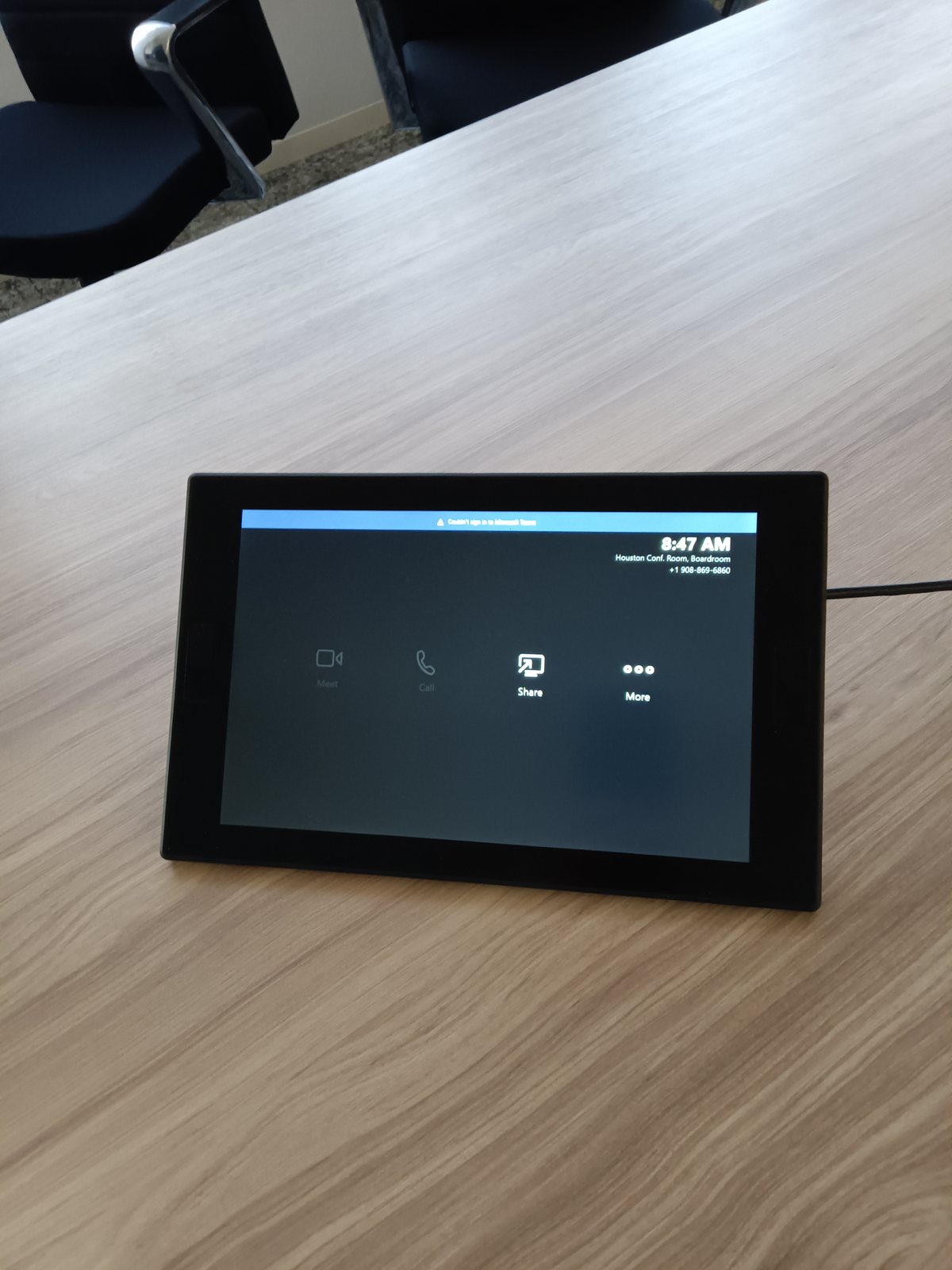 Meeting-room touch panel on a conference table
