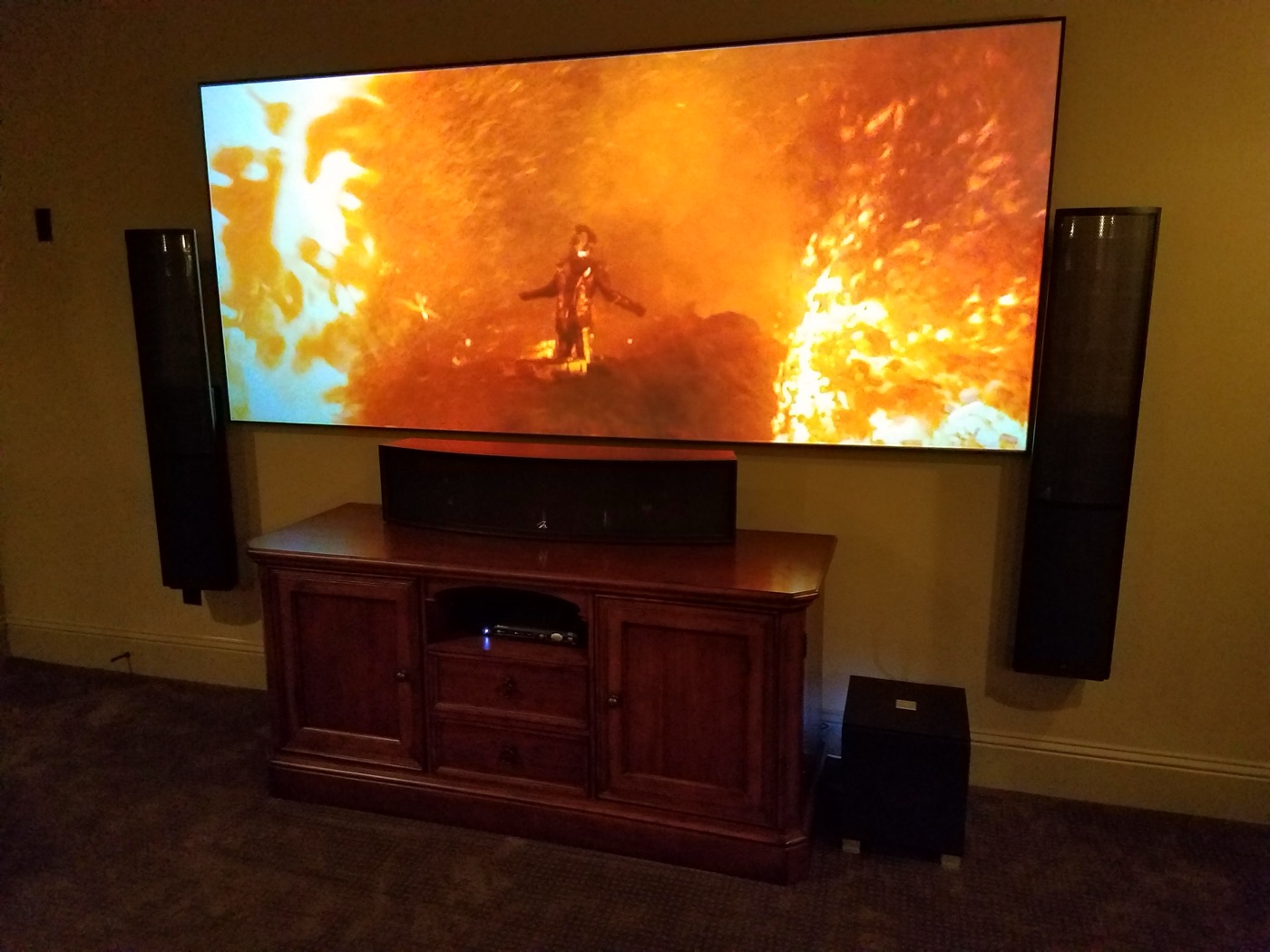 Carlton Woods area theater with wall-mounted MartinLogan towers, center channel and a 109-inch 2.35:1 CinemaScope screen