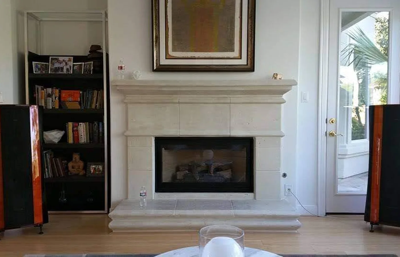 Houston two-channel listening room with floorstanding speakers positioned beside a fireplace