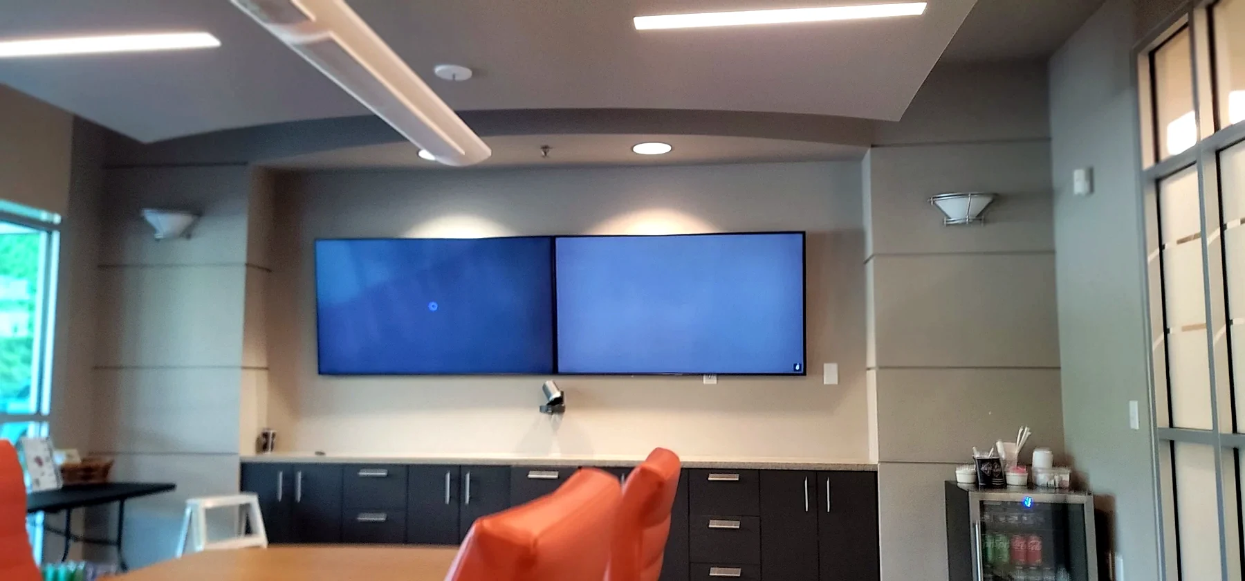 Houston commercial AV meeting room with dual displays and video conferencing system