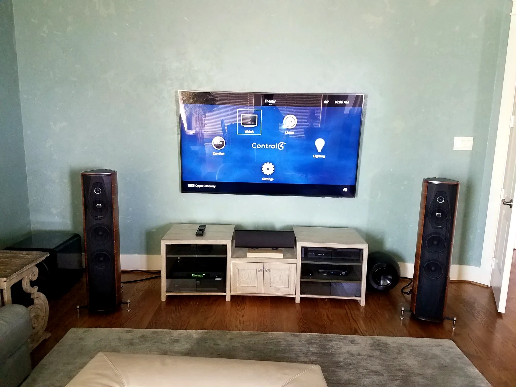 Full Control4 media room layout with TV tower speakers center channel equipment cabinet and subwoofers visible