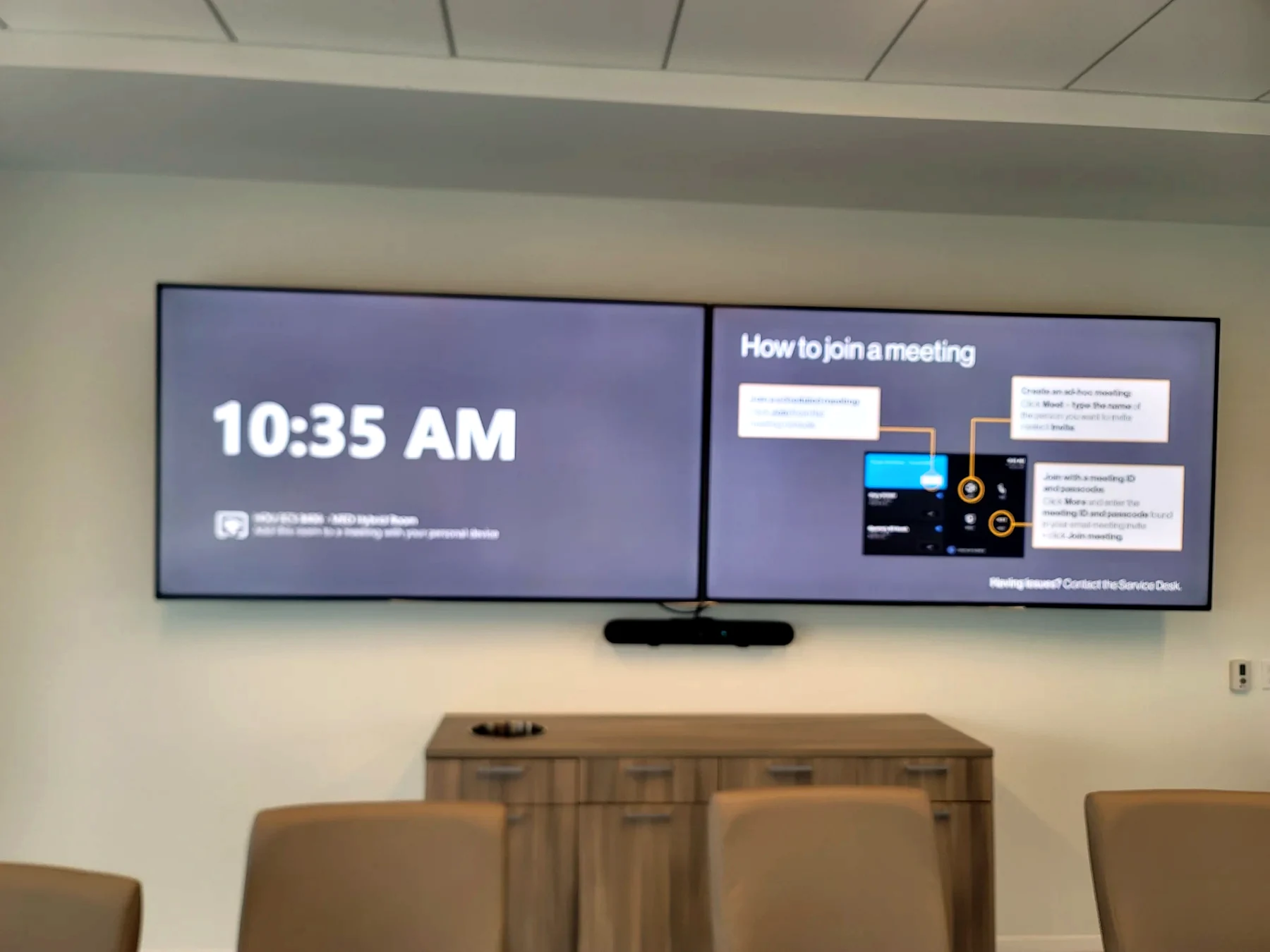Microsoft Teams Room style front display with camera and meeting room furniture in Houston